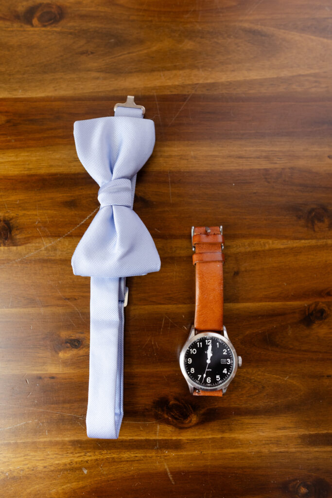 Detail shot of the groom's bowtie and watch. 