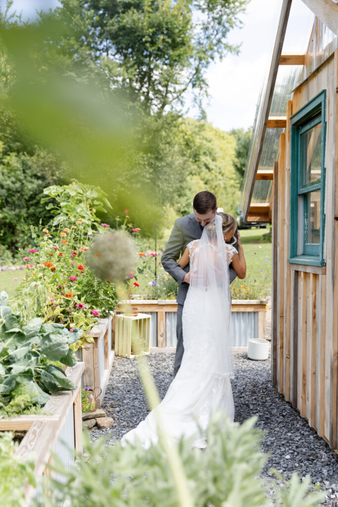 Bride and groom embrace after sharing their first look. 