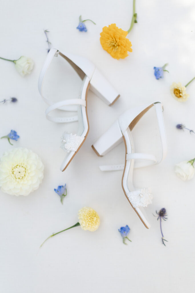 Detail shot of the bride's shoes and florals 